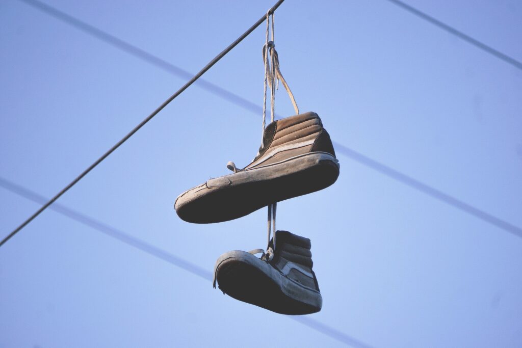 old shoes on telephone wire